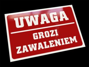 Metalowa ostrzegawcza tabliczka grozi zawaleniem. Oznaczenie budynku niebezpiecznego w użytkowaniu.